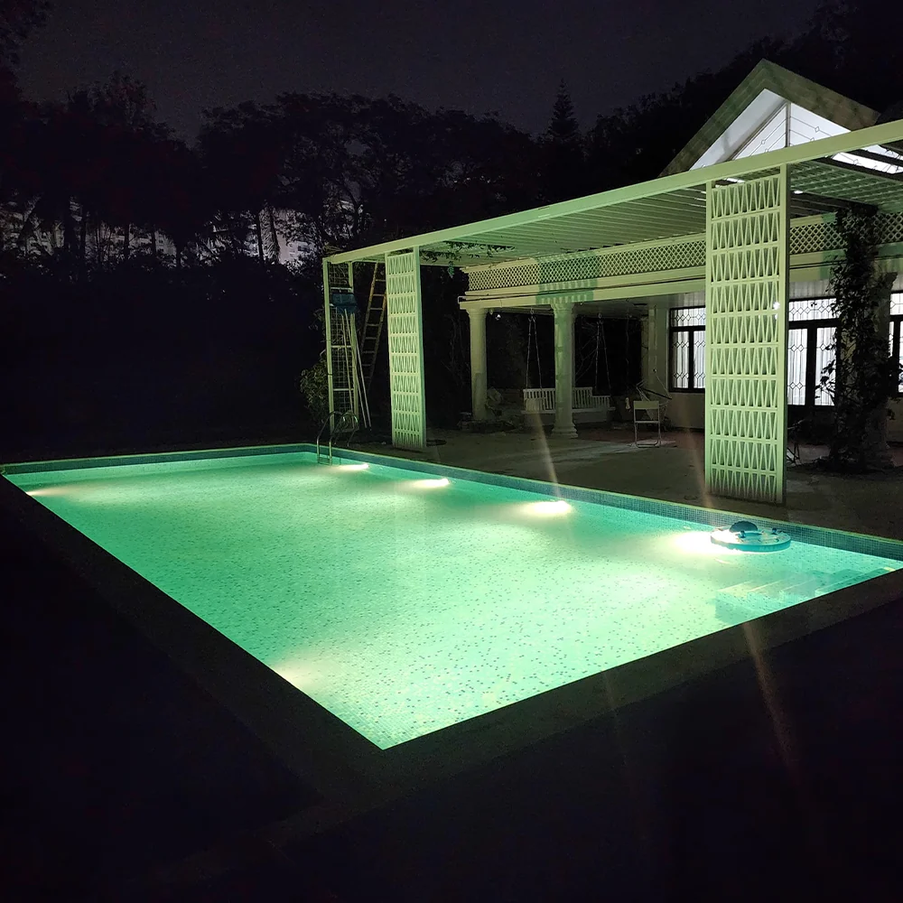 Underwater LED lighting in a swimming pool at night