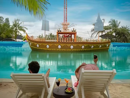 Wave pool with sand beach at Jollywood, Bidadi