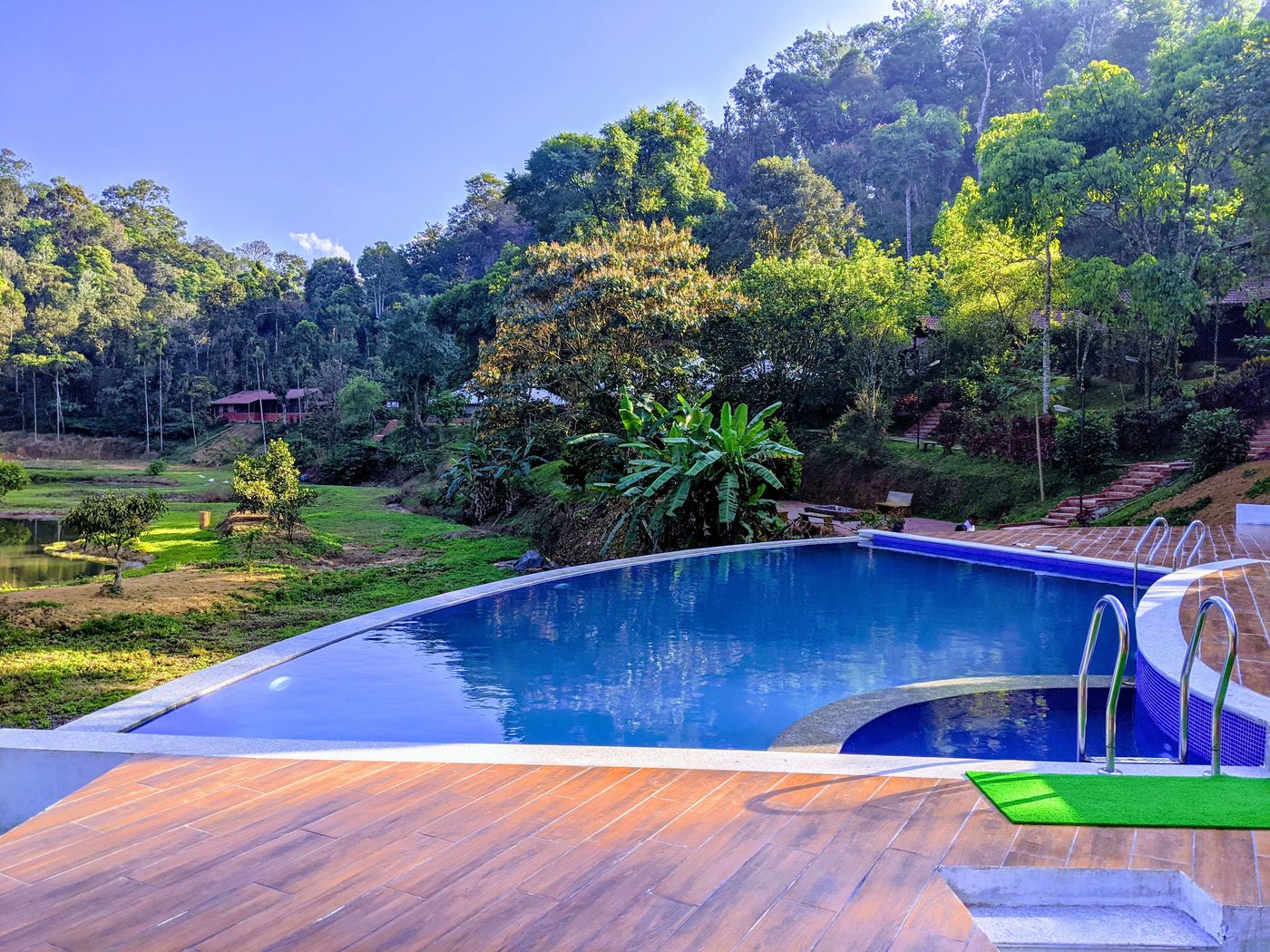 Infinity pool among the hills at Three Hills, Coorg